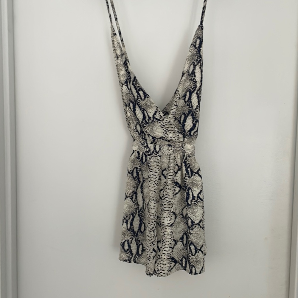 Toni size medium snake print romper with zipper back